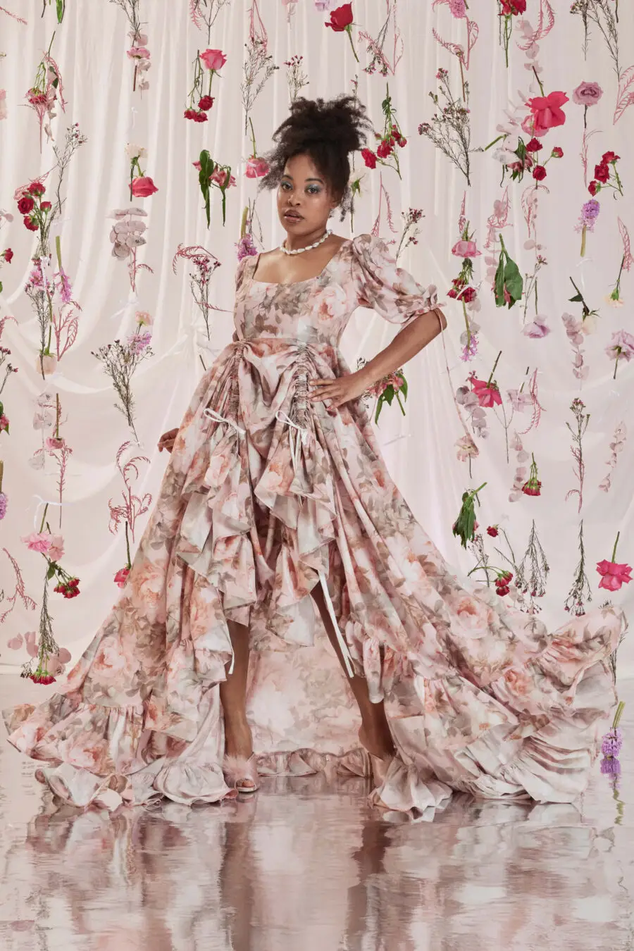 Gloria bustle gown in floral print - DISCLAIMER: Please note that all items within the Archive Sale are not eligible for returns. Some of the items in the Archive Sale may be production samples and may have been used for the collection photoshooting. It may have small flaws, however no rips or anything major that would make the iten unsuitable for wear. If you would like to receive photos of the item you are ordering, please feel free to get in touch and we will gladly photograph it for you.