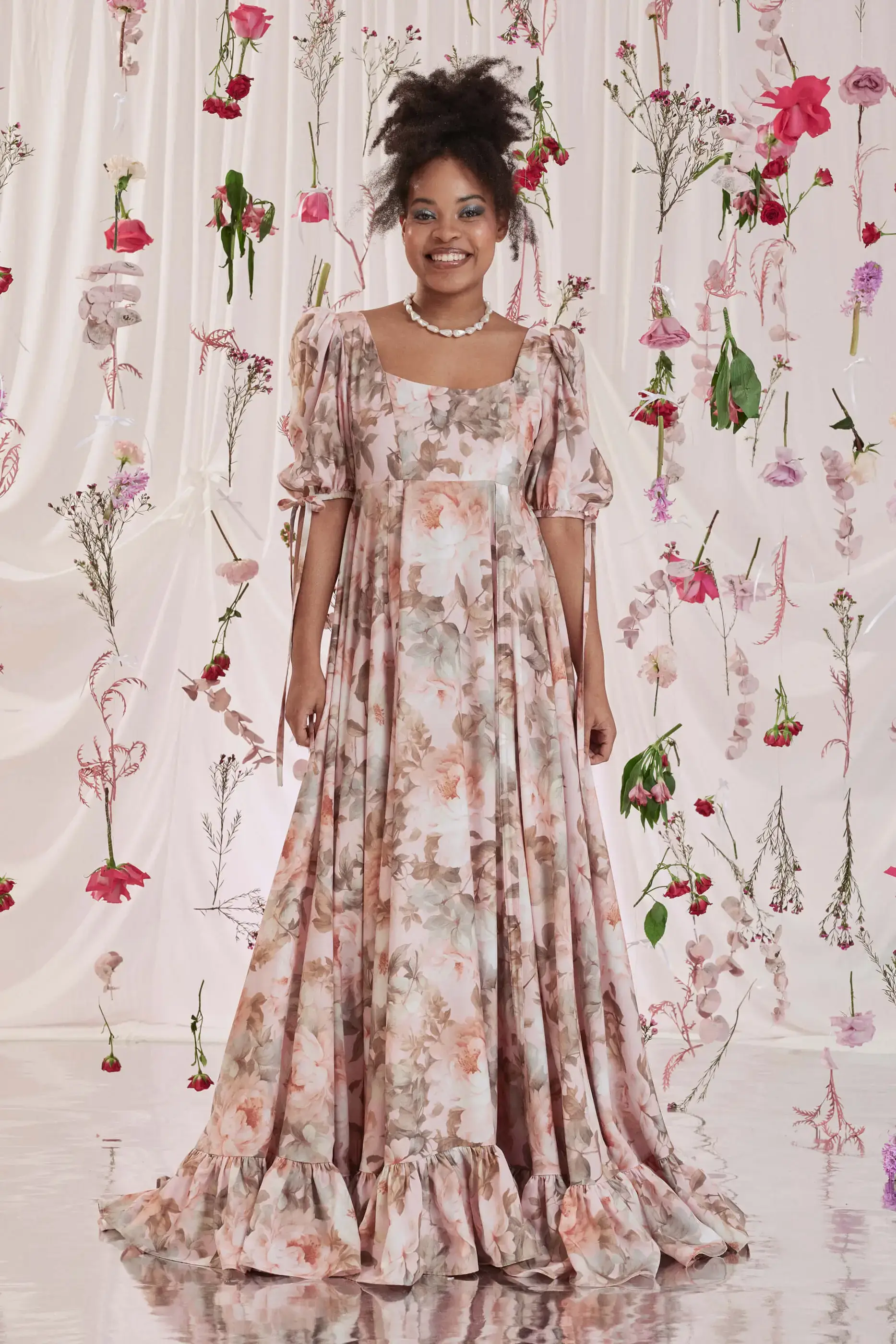 Archive Sale Gloria Bustle Gown In Floral Print 2 Gloria Bustle Gown In Floral Print Gloria bustle gown in floral print DISCLAIMER: Please note that all items within the Archive Sale are not eligible for returns. Some of the items in the Archive Sale may be production samples and may have been used for the collection photoshooting. It may have small flaws, however no rips or anything major that would make the iten unsuitable for wear. If you would like to receive photos of the item you are ordering, please feel free to get in touch and we will gladly photograph it for you.