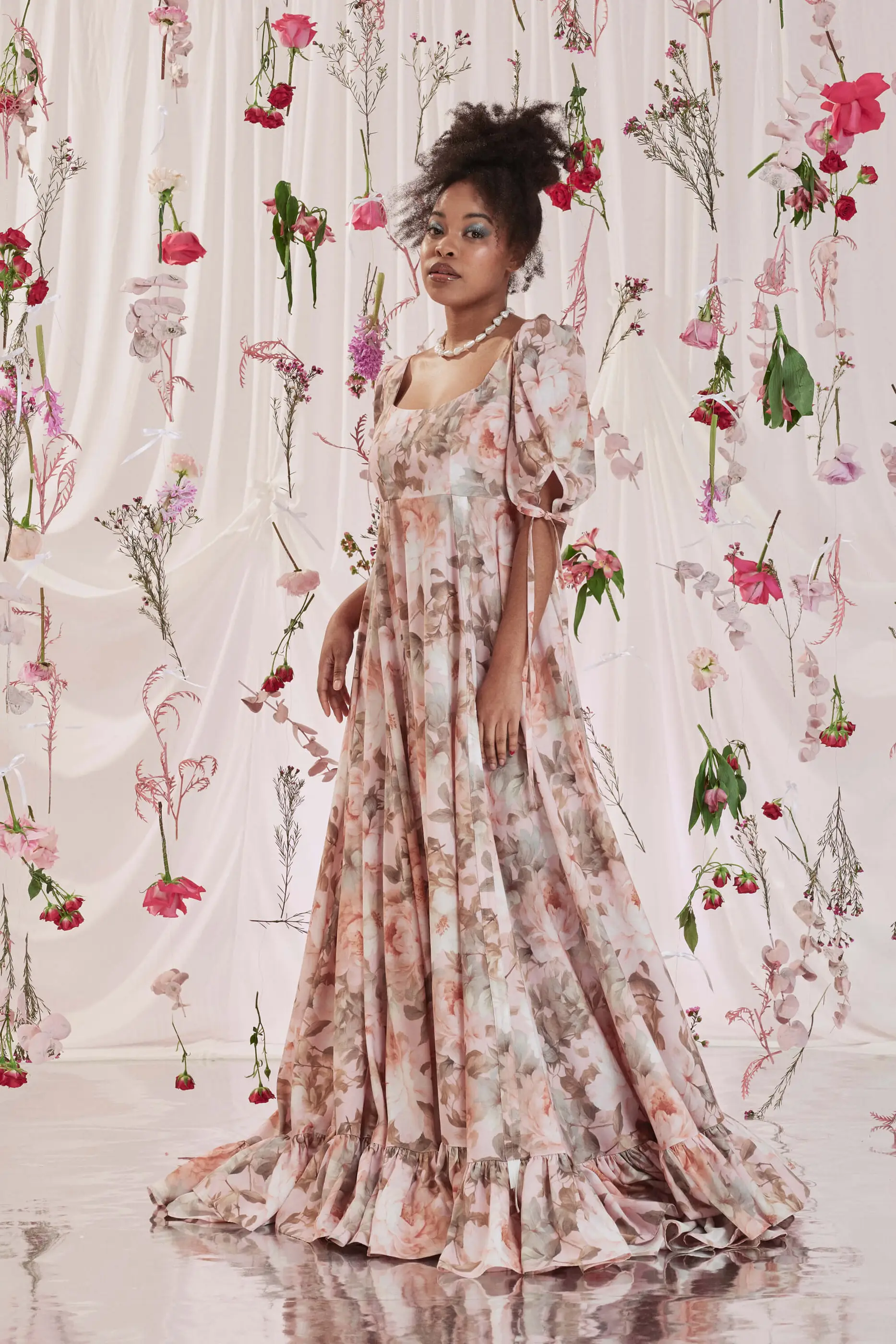 Archive Sale Gloria Bustle Gown In Floral Print 3 Gloria Bustle Gown In Floral Print Gloria bustle gown in floral print DISCLAIMER: Please note that all items within the Archive Sale are not eligible for returns. Some of the items in the Archive Sale may be production samples and may have been used for the collection photoshooting. It may have small flaws, however no rips or anything major that would make the iten unsuitable for wear. If you would like to receive photos of the item you are ordering, please feel free to get in touch and we will gladly photograph it for you.
