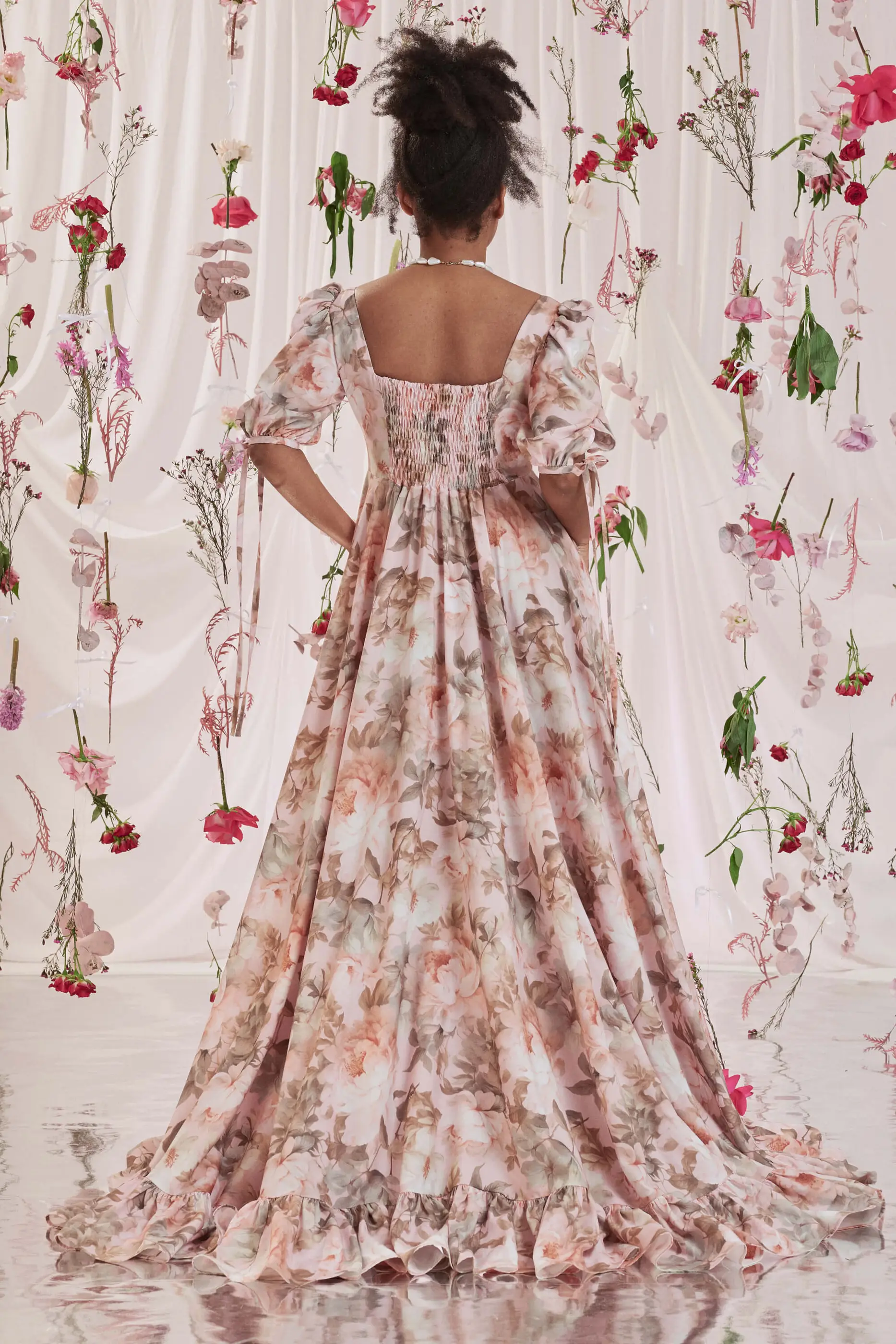 Archive Sale Gloria Bustle Gown In Floral Print 6 Gloria Bustle Gown In Floral Print Gloria bustle gown in floral print DISCLAIMER: Please note that all items within the Archive Sale are not eligible for returns. Some of the items in the Archive Sale may be production samples and may have been used for the collection photoshooting. It may have small flaws, however no rips or anything major that would make the iten unsuitable for wear. If you would like to receive photos of the item you are ordering, please feel free to get in touch and we will gladly photograph it for you.