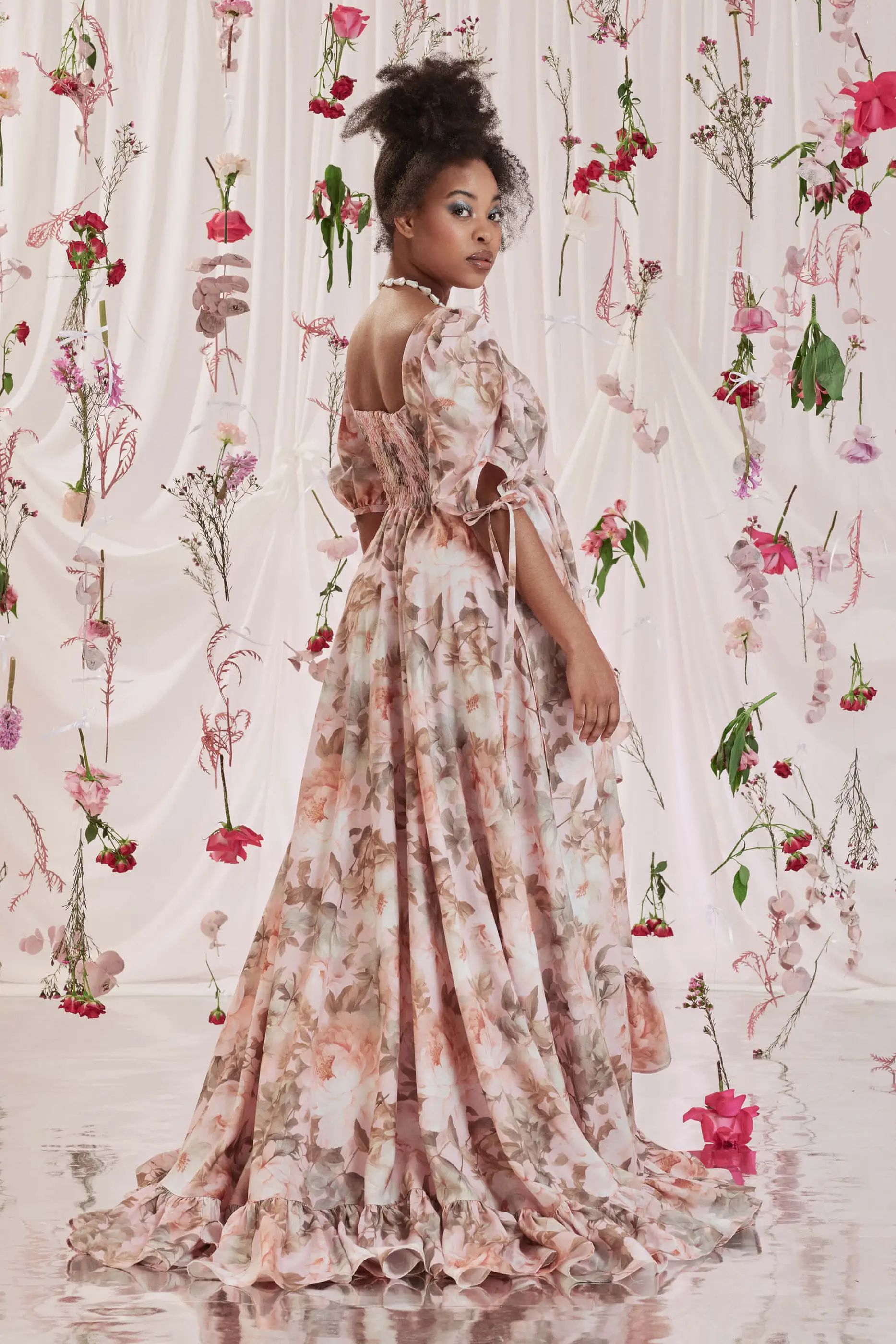Archive Sale Gloria Bustle Gown In Floral Print 7 Gloria Bustle Gown In Floral Print Gloria bustle gown in floral print DISCLAIMER: Please note that all items within the Archive Sale are not eligible for returns. Some of the items in the Archive Sale may be production samples and may have been used for the collection photoshooting. It may have small flaws, however no rips or anything major that would make the iten unsuitable for wear. If you would like to receive photos of the item you are ordering, please feel free to get in touch and we will gladly photograph it for you.