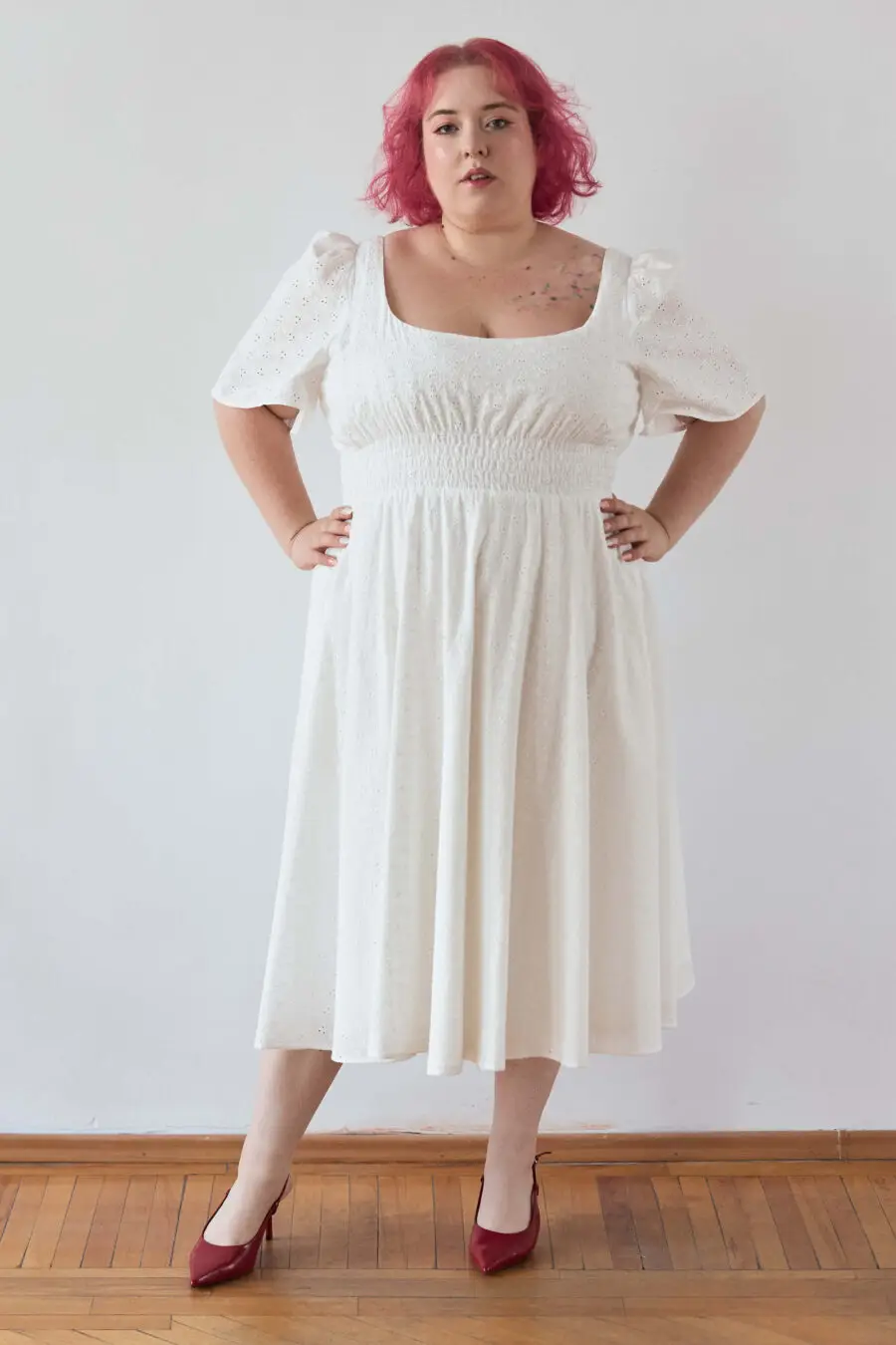 Audre ruched midi dress in embroidered white - A romantic midi dress with a square neckline, puffed short sleeves, and a comfortable smocked waist, crafted from pink gingham.