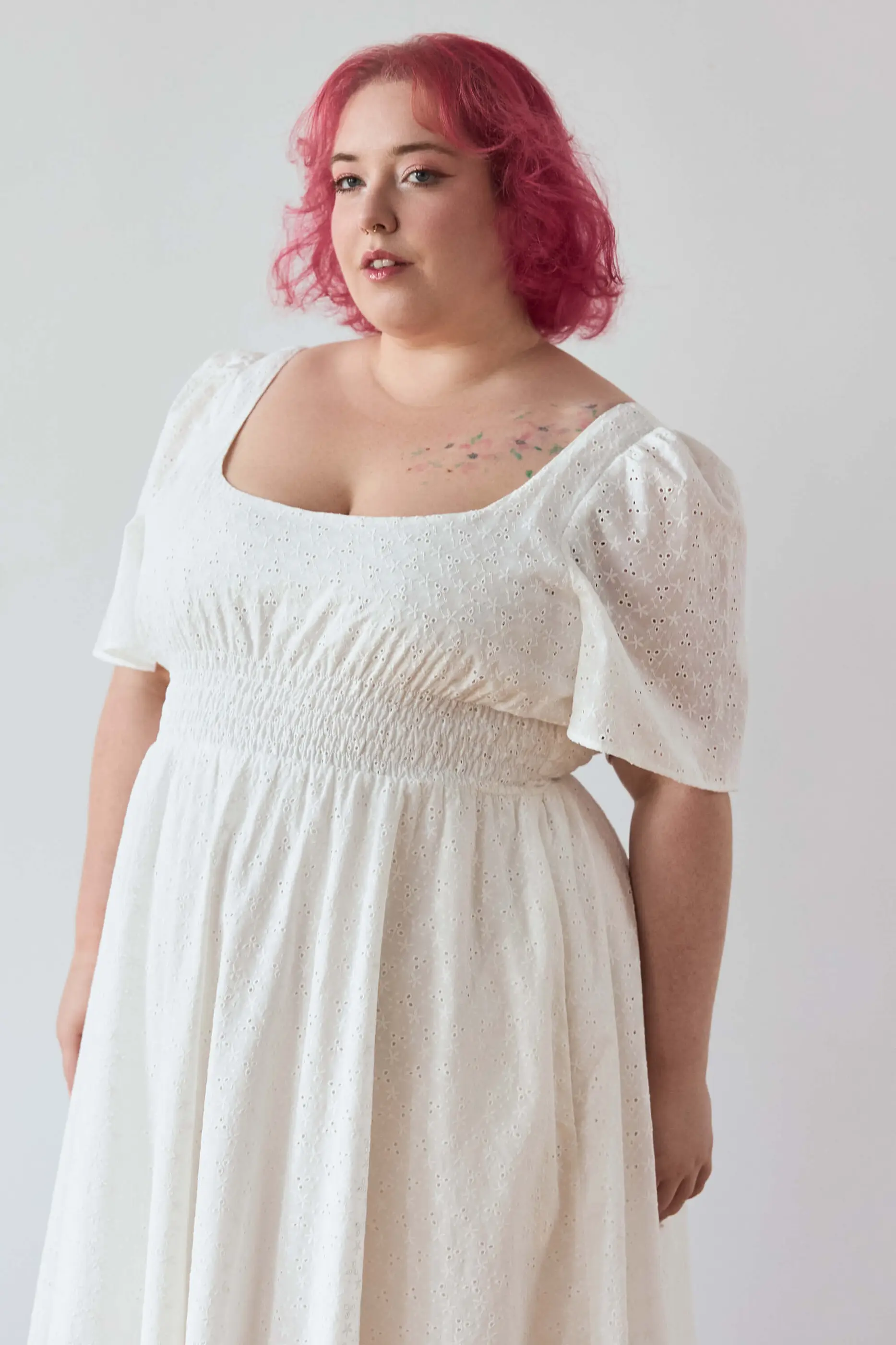Summer 2025 Audre Ruched Midi Dress In Embroidered White 10 Audre Ruched Midi Dress In Embroidered White Audre ruched midi dress in embroidered white A romantic midi dress with a square neckline, puffed short sleeves, and a comfortable smocked waist, crafted from pink gingham.