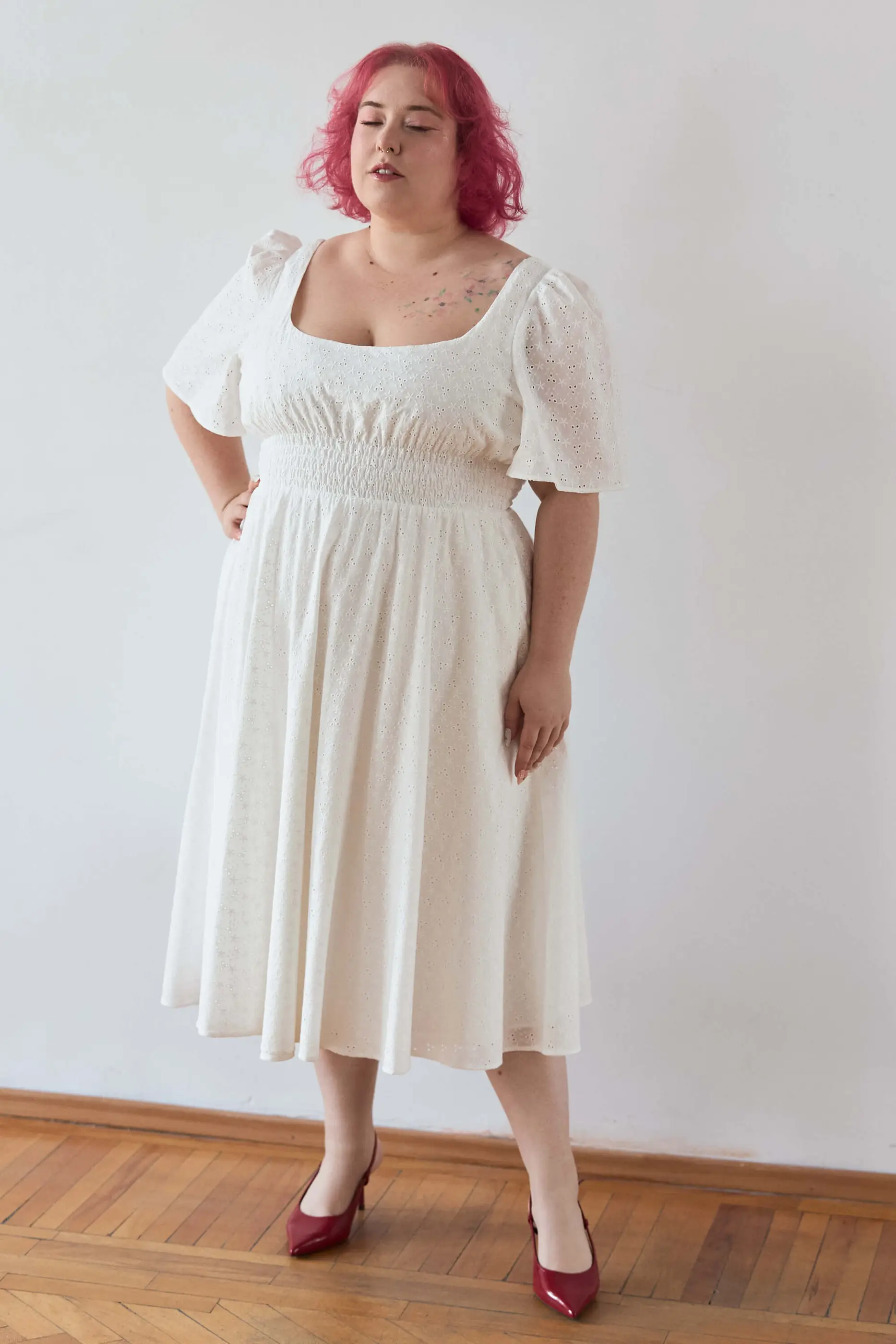 Summer 2025 Audre Ruched Midi Dress In Embroidered White 4 Audre Ruched Midi Dress In Embroidered White Audre ruched midi dress in embroidered white A romantic midi dress with a square neckline, puffed short sleeves, and a comfortable smocked waist, crafted from pink gingham.