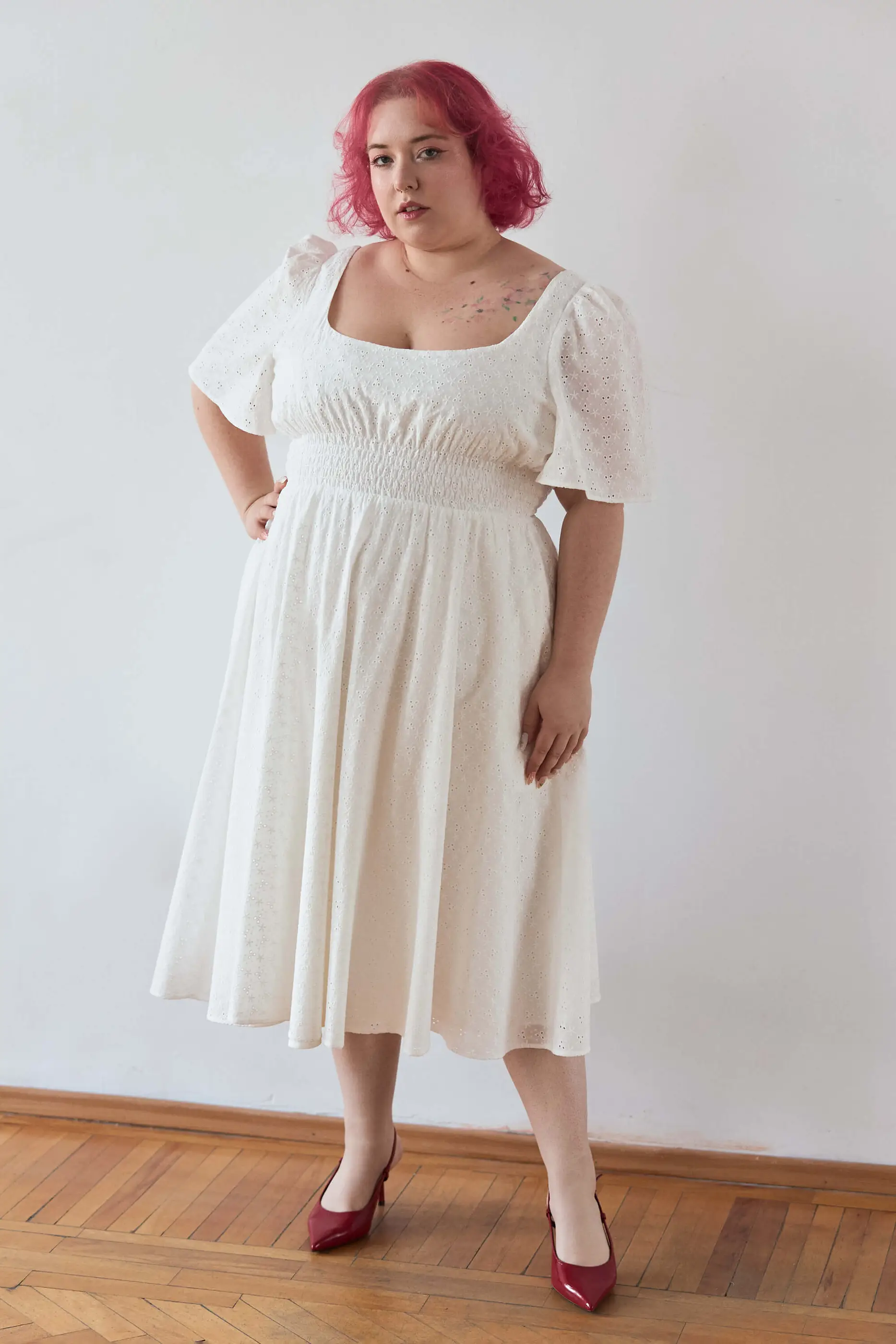 Summer 2025 Audre Ruched Midi Dress In Embroidered White 9 Audre Ruched Midi Dress In Embroidered White Audre ruched midi dress in embroidered white A romantic midi dress with a square neckline, puffed short sleeves, and a comfortable smocked waist, crafted from pink gingham.
