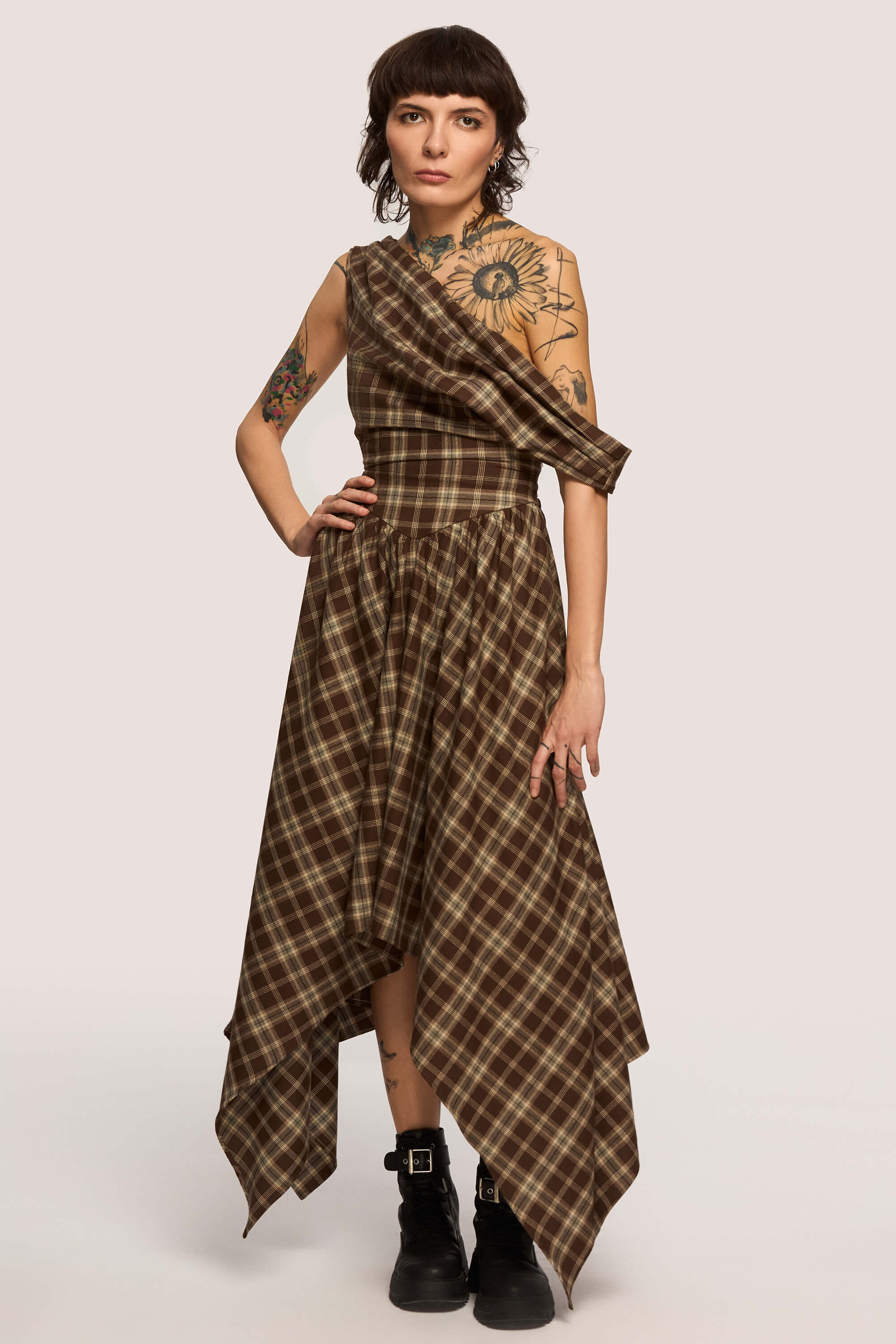 Winter 2025 Delta Of Venus Corset Dress In Chestnut Plaid 4 Delta Of Venus Corset Dress In Chestnut Plaid Delta of Venus corset dress in chestnut plaid A silhouette that doesn’t ask you to shrink.
