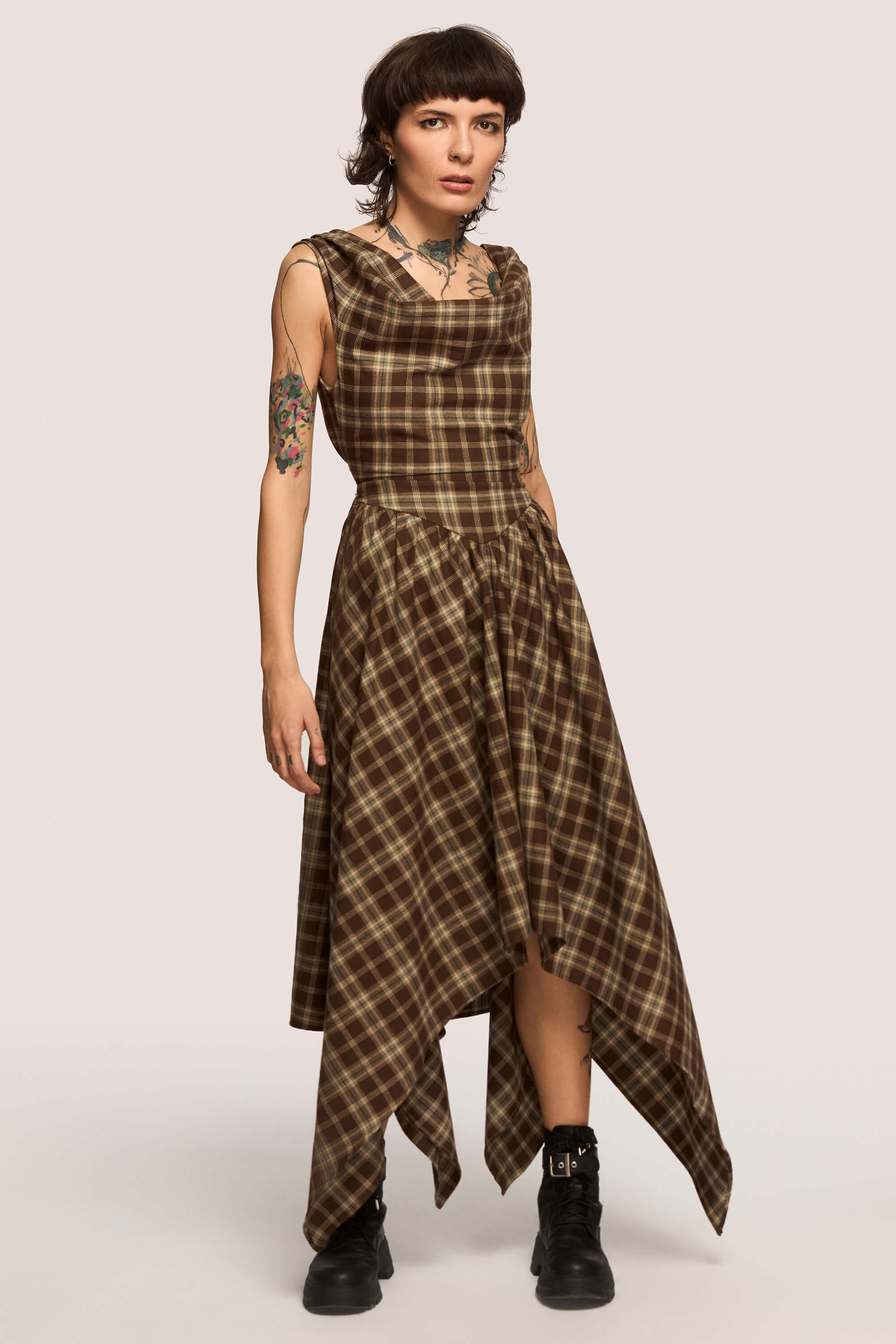 Winter 2025 Delta Of Venus Corset Dress In Chestnut Plaid 7 Delta Of Venus Corset Dress In Chestnut Plaid Delta of Venus corset dress in chestnut plaid A silhouette that doesn’t ask you to shrink.
