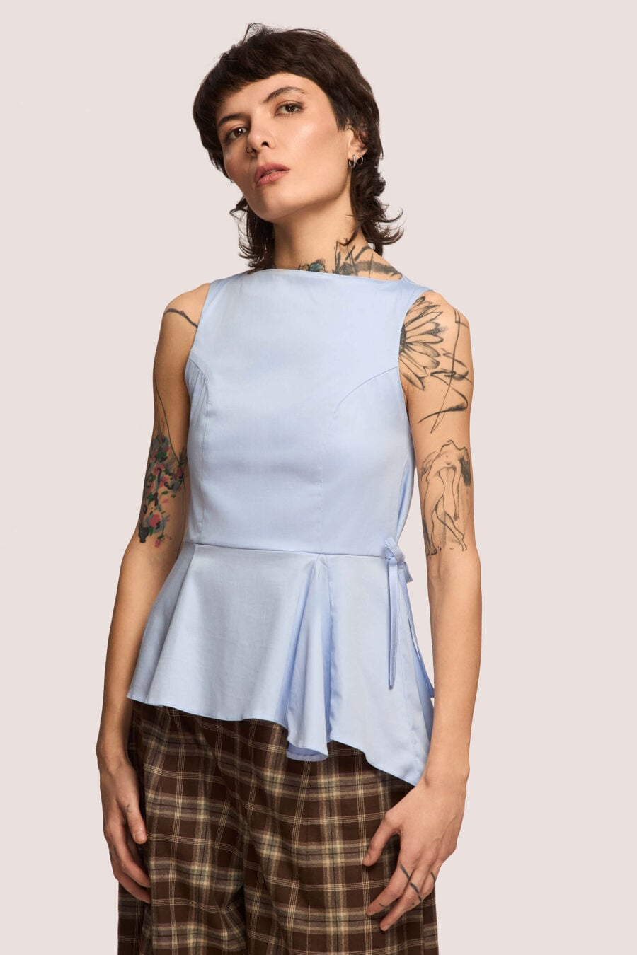 Invisibility Blues sleeveless shirt in sky blue - A silhouette that moulds to your shape, not the world’s expectations.