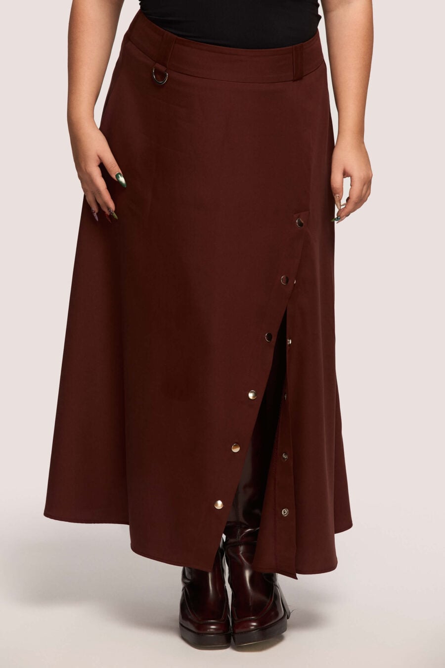 The Vegetarian midi skirt in bordeaux - Made to hold you without squeezing, a shape that follows your rhythm, not the world’s expectations. For long walks, long talks, the long sigh of relief when you finally get home.