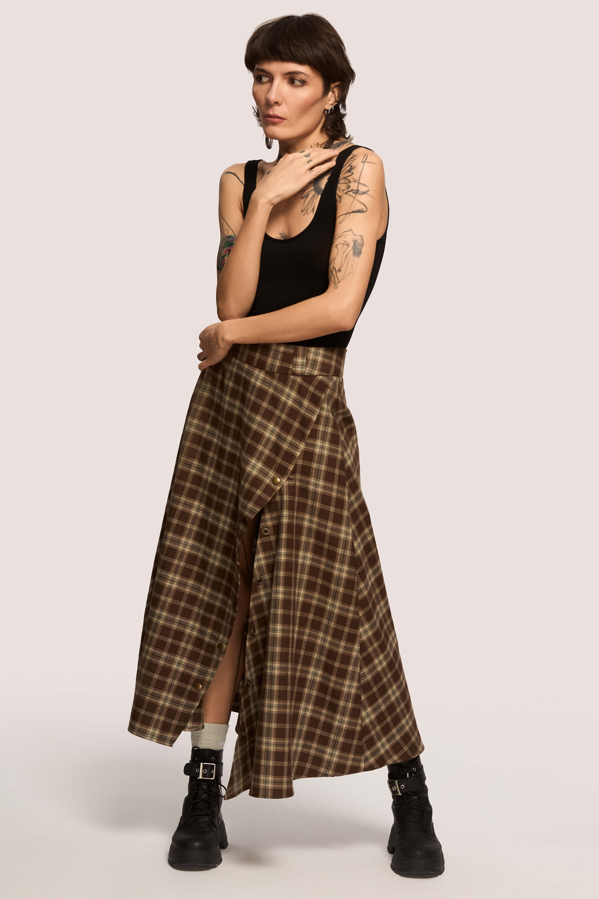 Winter 2025 The Vegetarian Midi Skirt In Chestnut Plaid 1 The Vegetarian Midi Skirt In Chestnut Plaid The Vegetarian midi skirt in chestnut plaid Made to hold you without squeezing, a shape that follows your rhythm, not the world’s expectations. For long walks, long talks, the long sigh of relief when you finally get home.