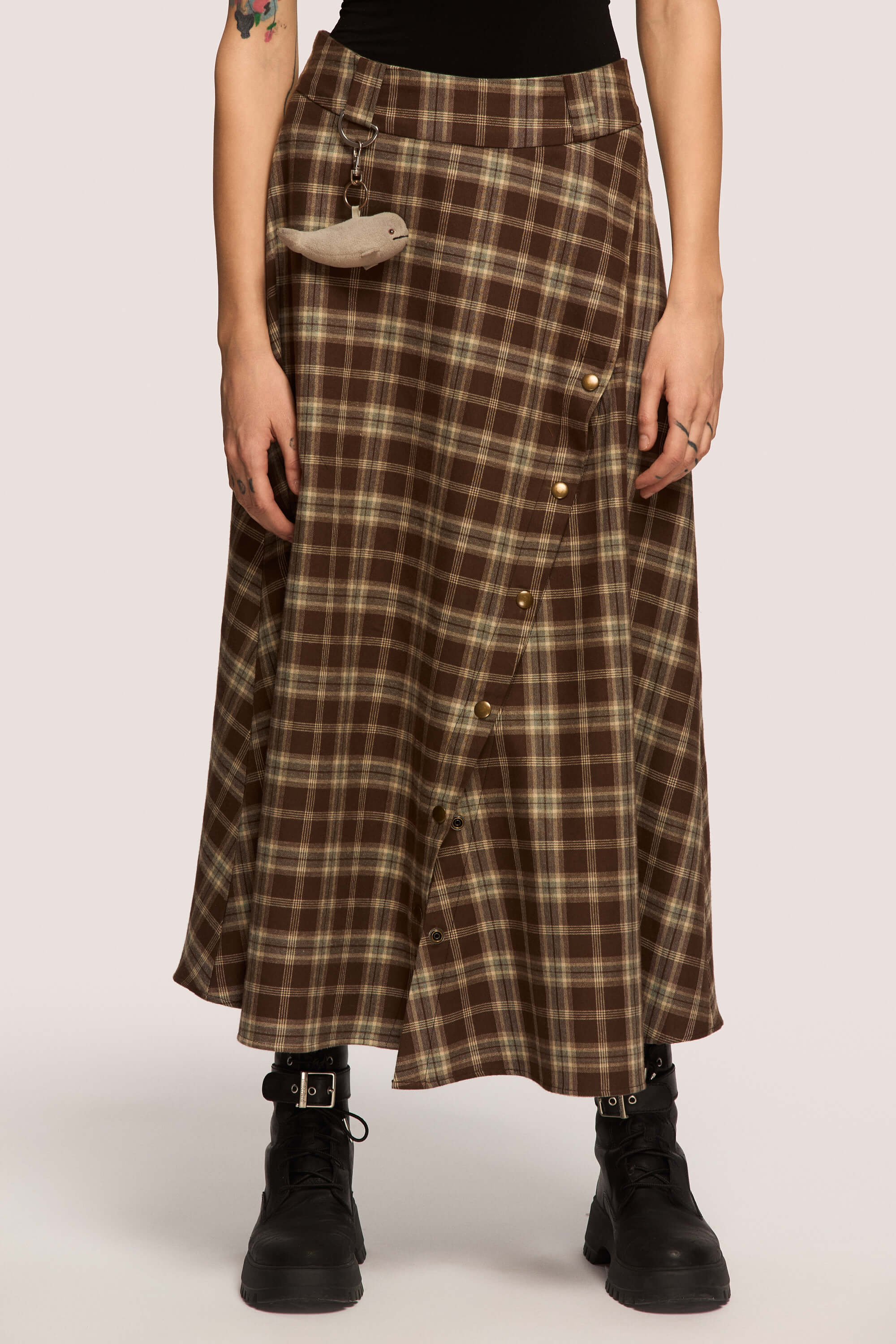 Winter 2025 The Vegetarian Midi Skirt In Chestnut Plaid 6 The Vegetarian Midi Skirt In Chestnut Plaid The Vegetarian midi skirt in chestnut plaid Made to hold you without squeezing, a shape that follows your rhythm, not the world’s expectations. For long walks, long talks, the long sigh of relief when you finally get home.