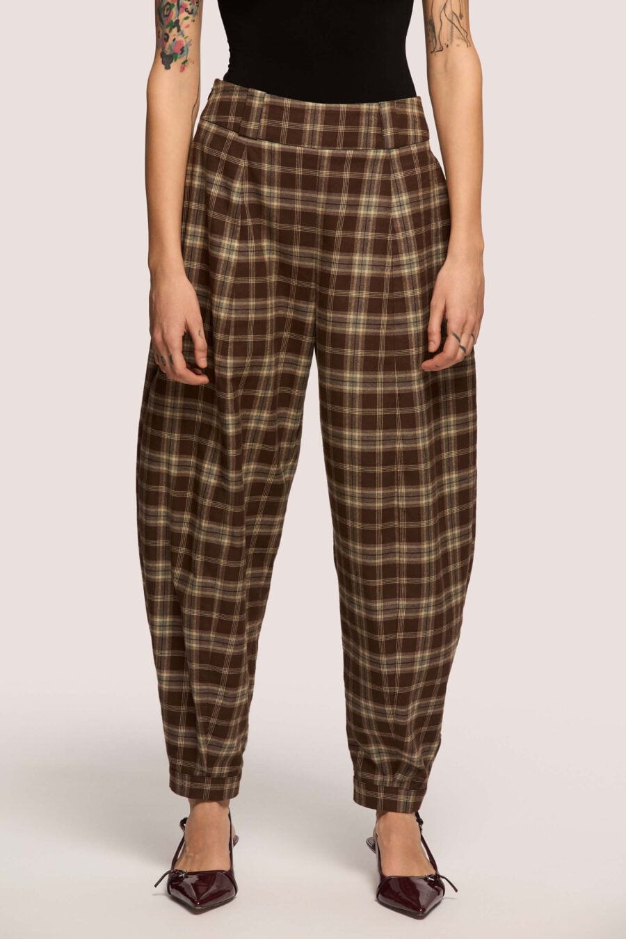 Troublemaker barrel leg pants in chestnut plaid - Designed for sitting, pacing, speaking up, walking away – a shape that shifts with you, not against you, with room for everything you carry. A fit that stays kind, even when the day isn’t.