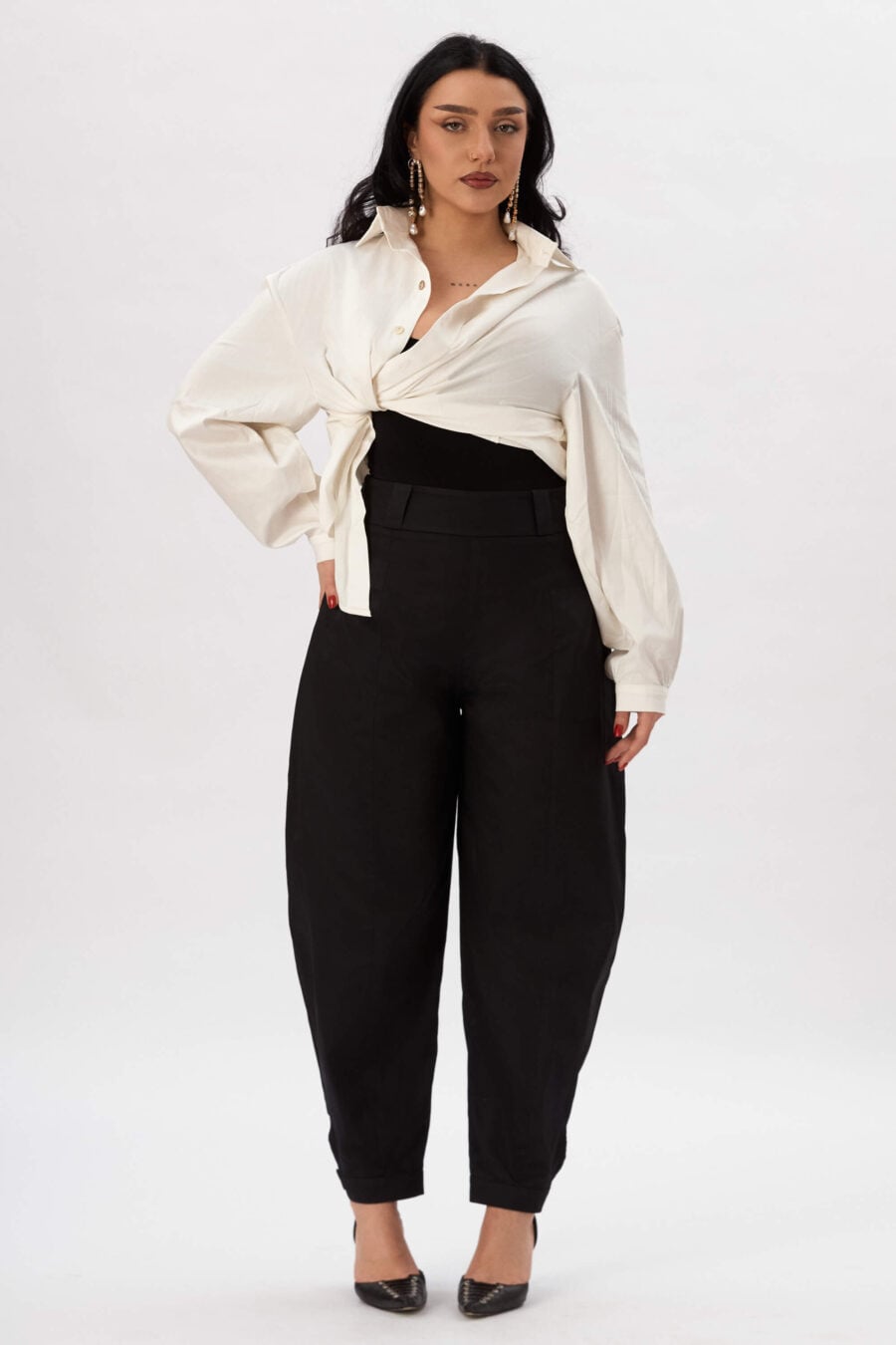 Troublemaker barrel leg pants in raven - Designed for sitting, pacing, speaking up, walking away – a shape that shifts with you, not against you, with room for everything you carry. A fit that stays kind, even when the day isn’t.