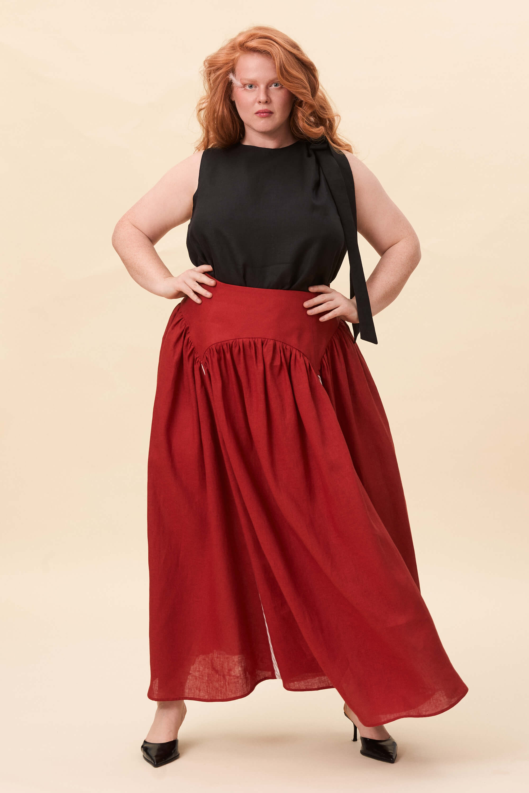 Spring 2026 Cordelia Gray Maxi Skirt In Tomato Red 5 Cordelia Gray Maxi Skirt In Tomato Red Cordelia Gray maxi skirt in tomato red The waist holds a fitted structure before releasing into a full, gathered skirt. Contrasting panels at the front and back shape the silhouette, introducing variation and rhythm as the garment moves.