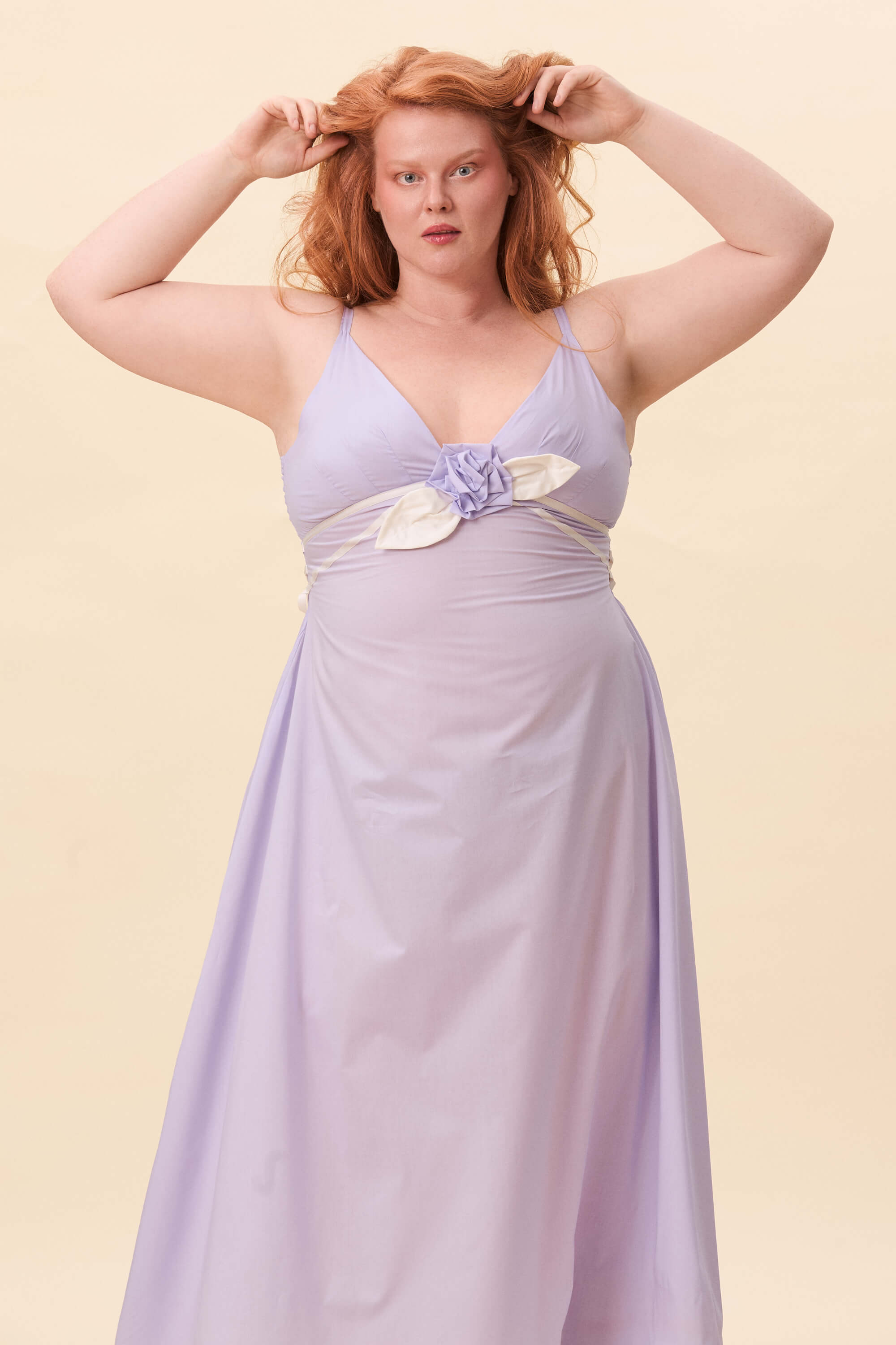 Spring 2026 Gone Girl Slip Dress In Lavender Voille 2 Gone Girl Slip Dress In Lavender Voille Gone Girl slip dress in lavender voille An elongated silhouette designed to move with ease. The focus gathers at the bust, to a sculptural rose from which two slender lines fall, guiding the eye downward and wrapping into a corset at the back. Form shaped through tension and release.
