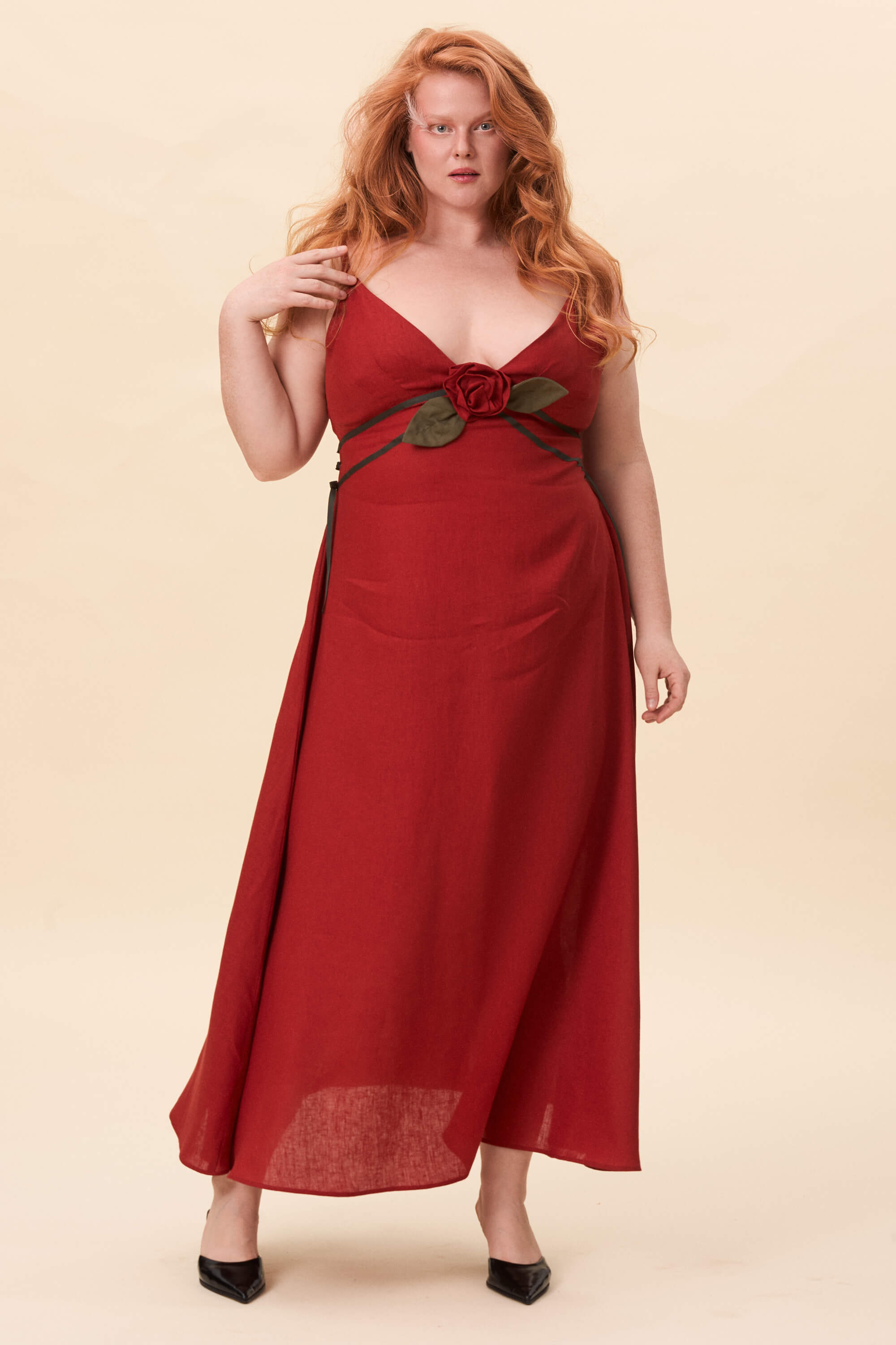 Spring 2026 Gone Girl Slip Dress In Tomato Red 2 Gone Girl Slip Dress In Tomato Red Gone Girl slip dress in tomato red An elongated silhouette designed to move with ease. The focus gathers at the bust, to a sculptural rose from which two slender lines fall, guiding the eye downward and wrapping into a corset at the back. Form shaped through tension and release.