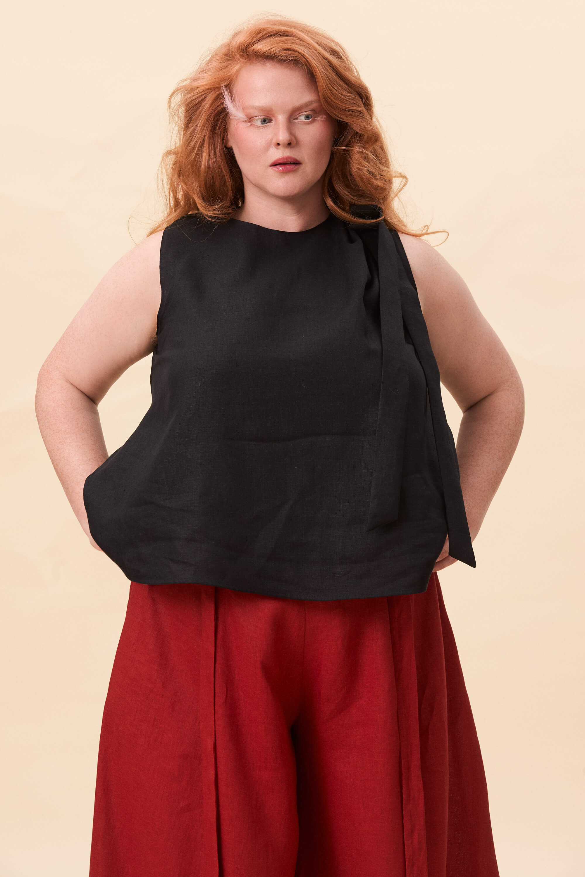 Spring 2026 Harriet Vane Top In Raven 1 Harriet Vane Top In Raven Harriet Vane top in raven A sleeveless top with a clean, uninterrupted front. The silhouette is relaxed, allowing it to fall naturally or be tucked for a more defined shape. A narrow tie detail sits at the side, introducing structure without altering the clean lines.