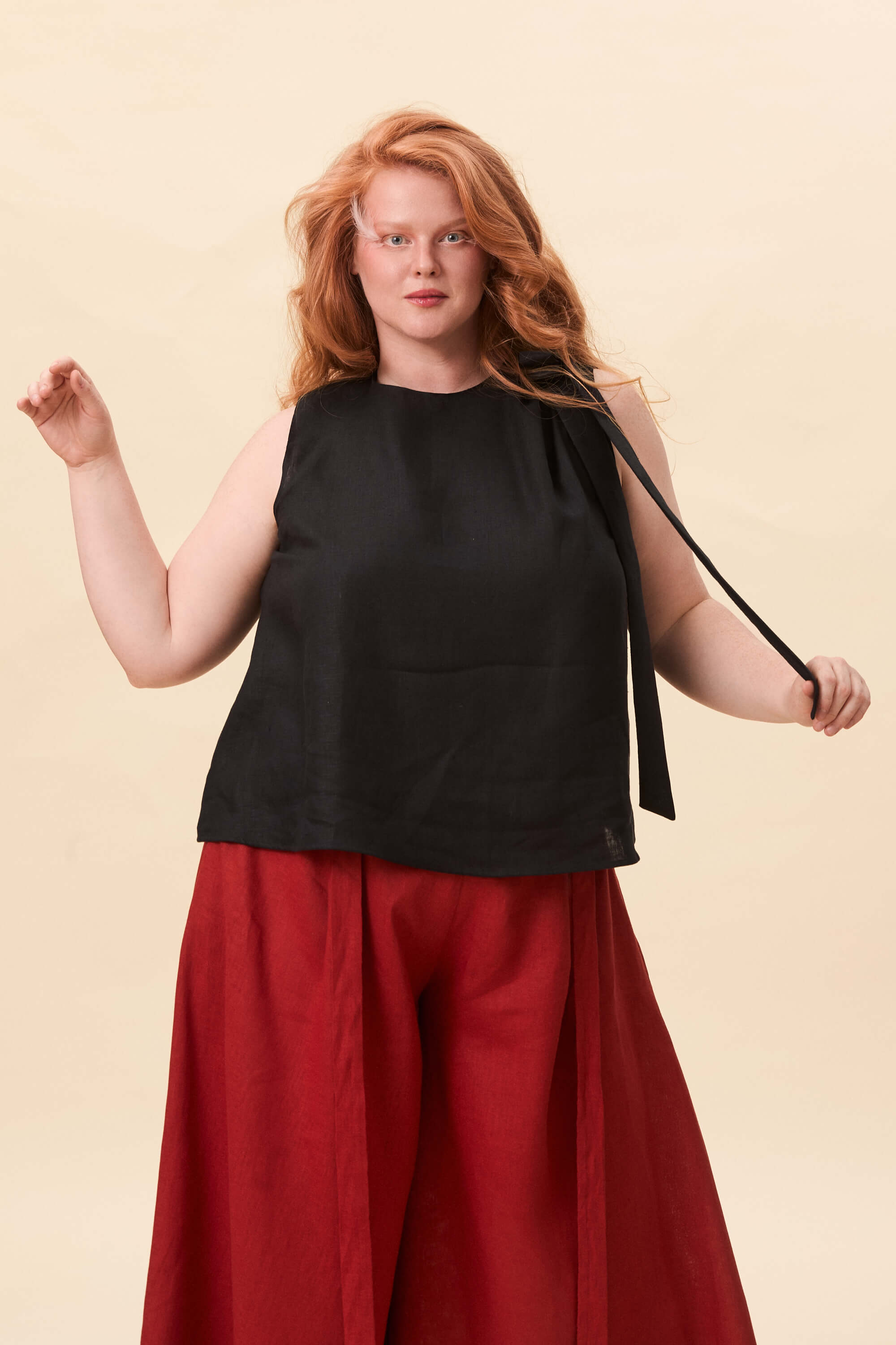 Spring 2026 Harriet Vane Top In Raven 2 Harriet Vane Top In Raven Harriet Vane top in raven A sleeveless top with a clean, uninterrupted front. The silhouette is relaxed, allowing it to fall naturally or be tucked for a more defined shape. A narrow tie detail sits at the side, introducing structure without altering the clean lines.