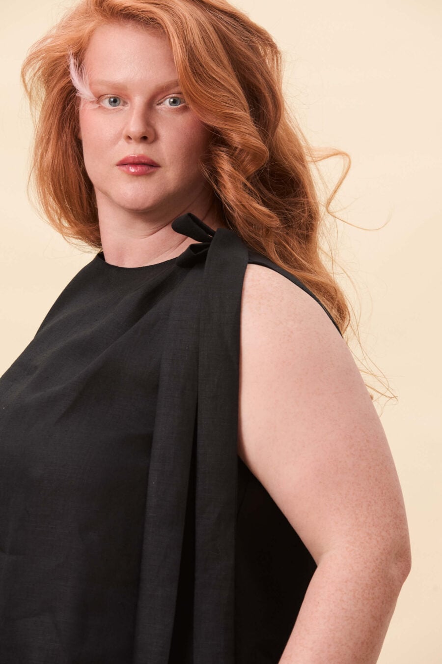 Harriet Vane top in raven - A sleeveless top with a clean, uninterrupted front. The silhouette is relaxed, allowing it to fall naturally or be tucked for a more defined shape. A narrow tie detail sits at the side, introducing structure without altering the clean lines.