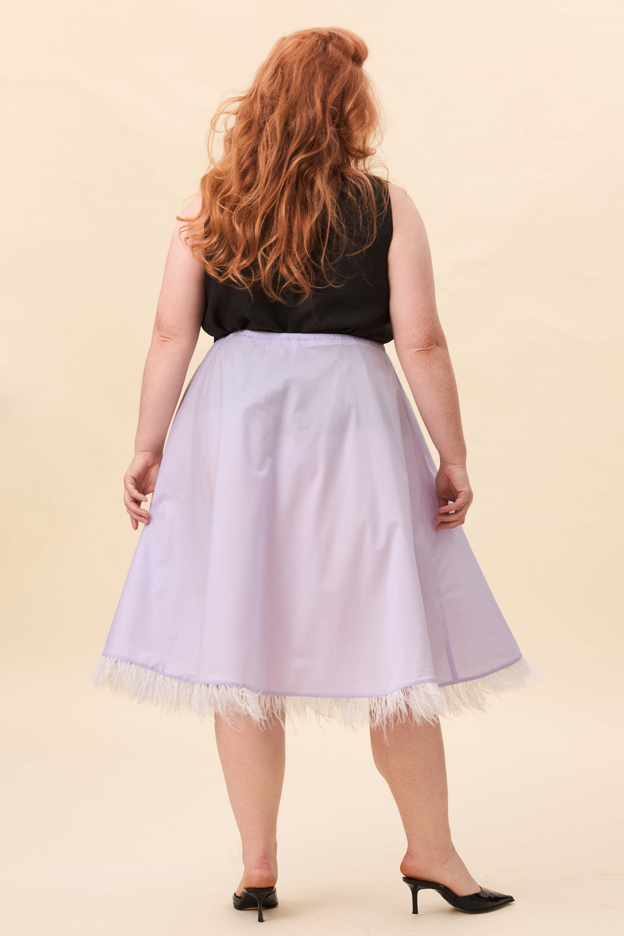Spring 2026 The Secret History Skirt In Lavender Voille 3 The Secret History Skirt In Lavender Voille The Secret History skirt in lavender voille A biascut skirt that follows the body with a fluid, uninterrupted line. The shape remains simple, allowing the drape to define the silhouette. Along the hem, a feather trim introduces movement and a soft shift in texture.